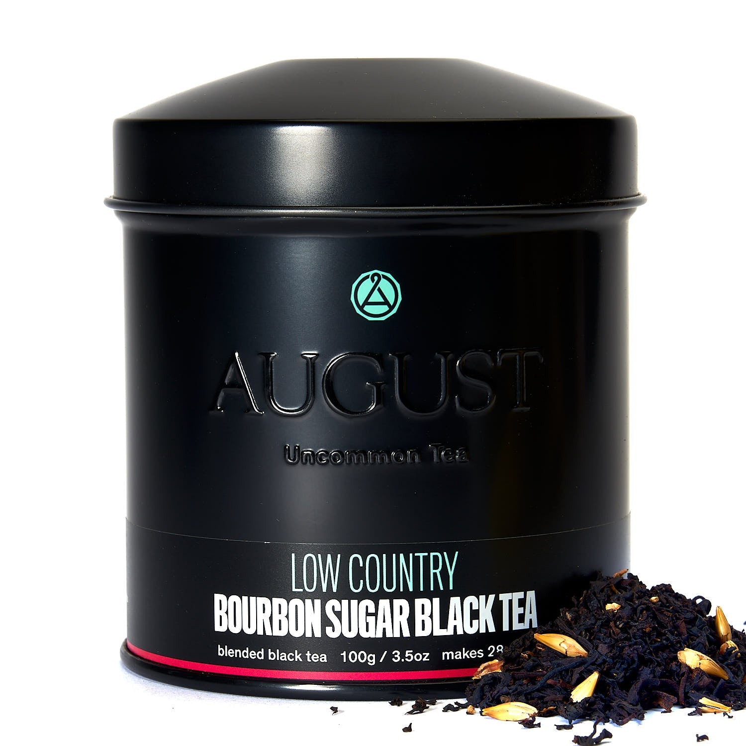 August Low Country - Bourbon Sugar Black Tea in a tin with tea leaves displayed alongside