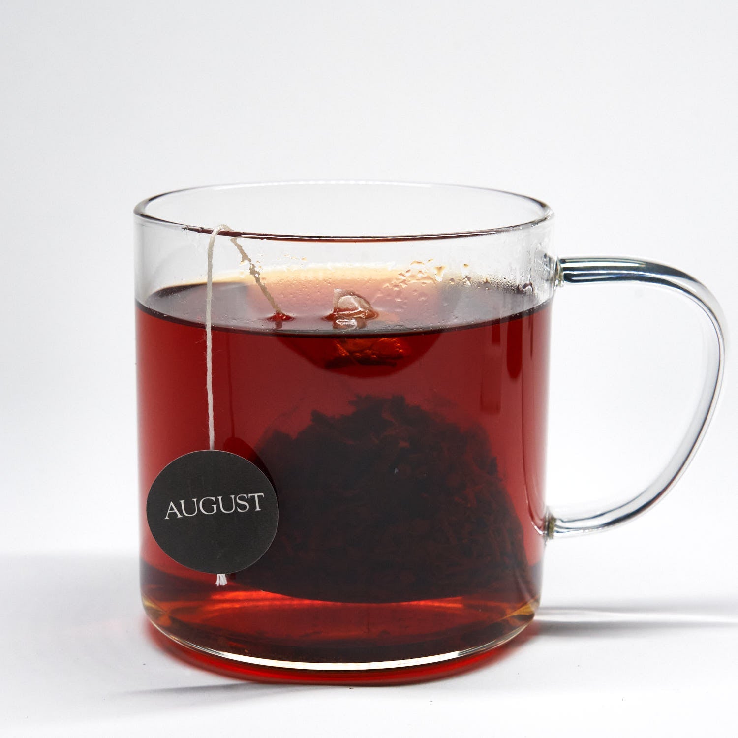 August Low Country - 15 Tea Bags in a brewing process, showcasing the tea bag and water infusion