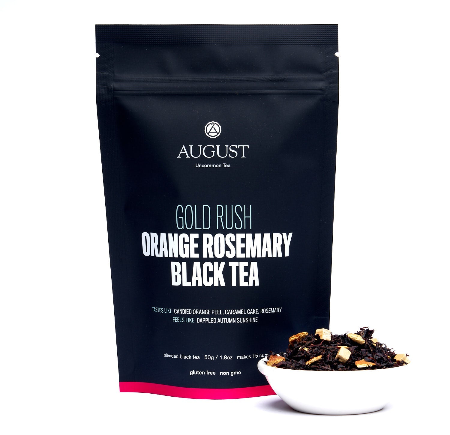 August Gold Rush - Orange Rosemary Caramel Black Tea in a tasting setup with a cup and notebook