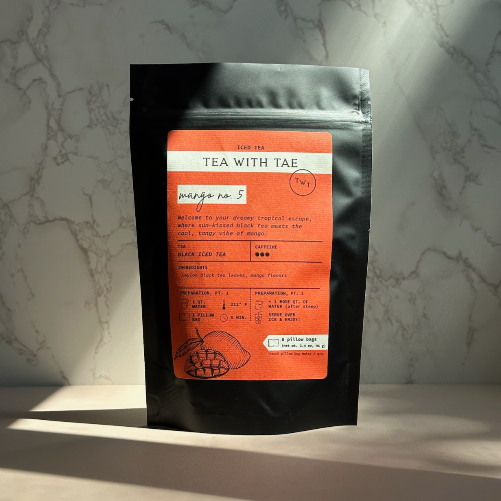 Tea with Tae Mango No. 5 Iced Black Tea pouch featuring a vibrant design, packaged for iced tea preparation.