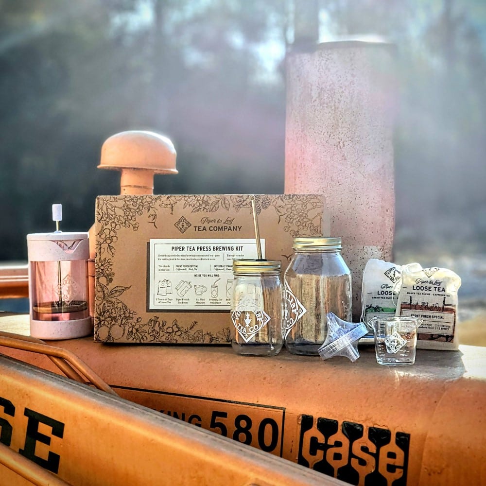 Piper and Leaf Piper Press Brew Kit displayed in a custom setting, featuring brewing equipment and tea accessories.
