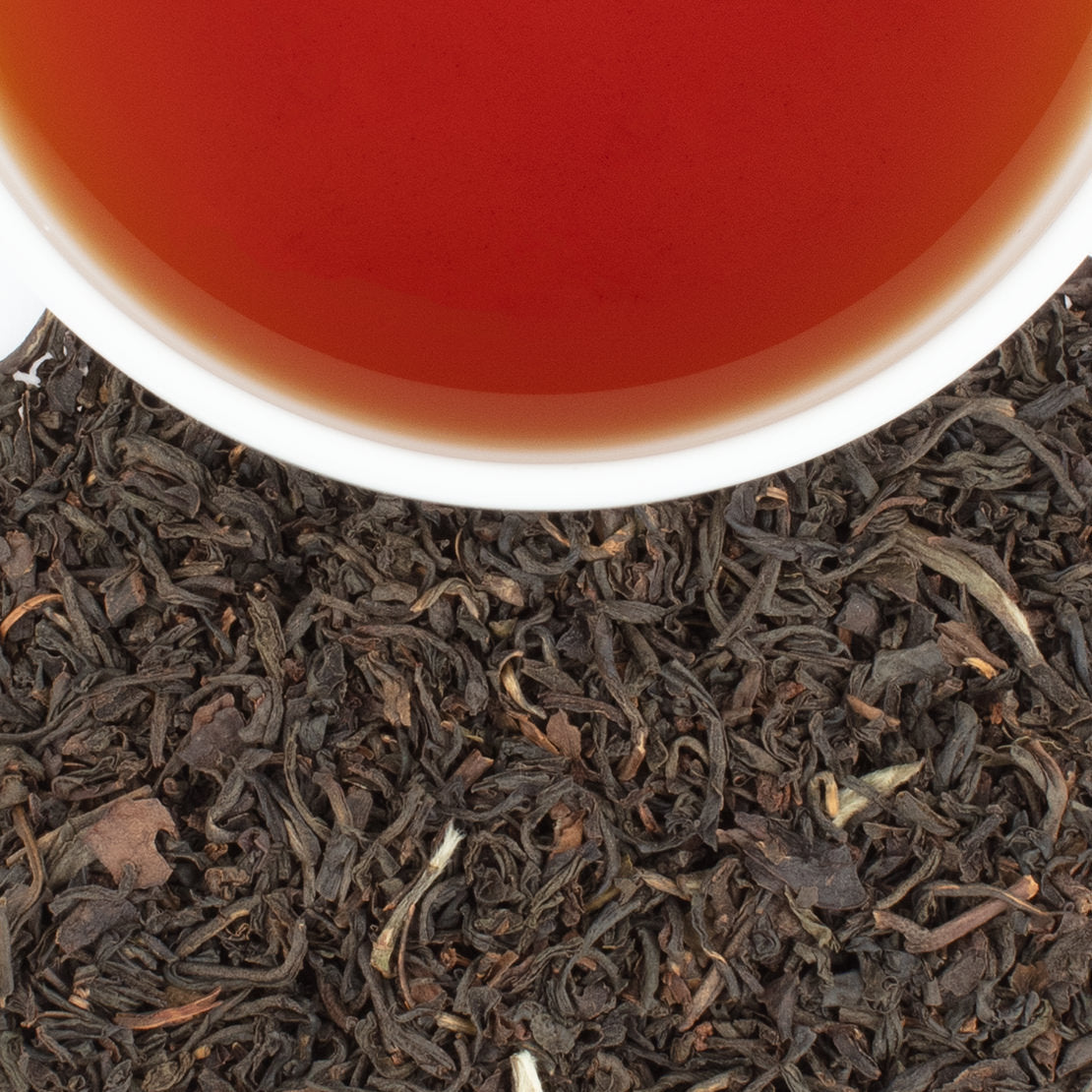 Harney & Sons Earl Grey Supreme displayed in a cup, featuring black tea with silver tips and bergamot notes.