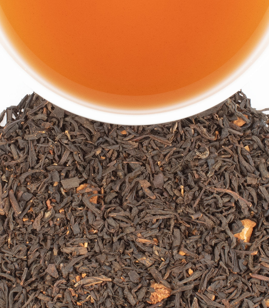 Harney & Sons Apple Cinnamon black tea blend in a cup, showcasing its rich aroma and warm cinnamon notes.