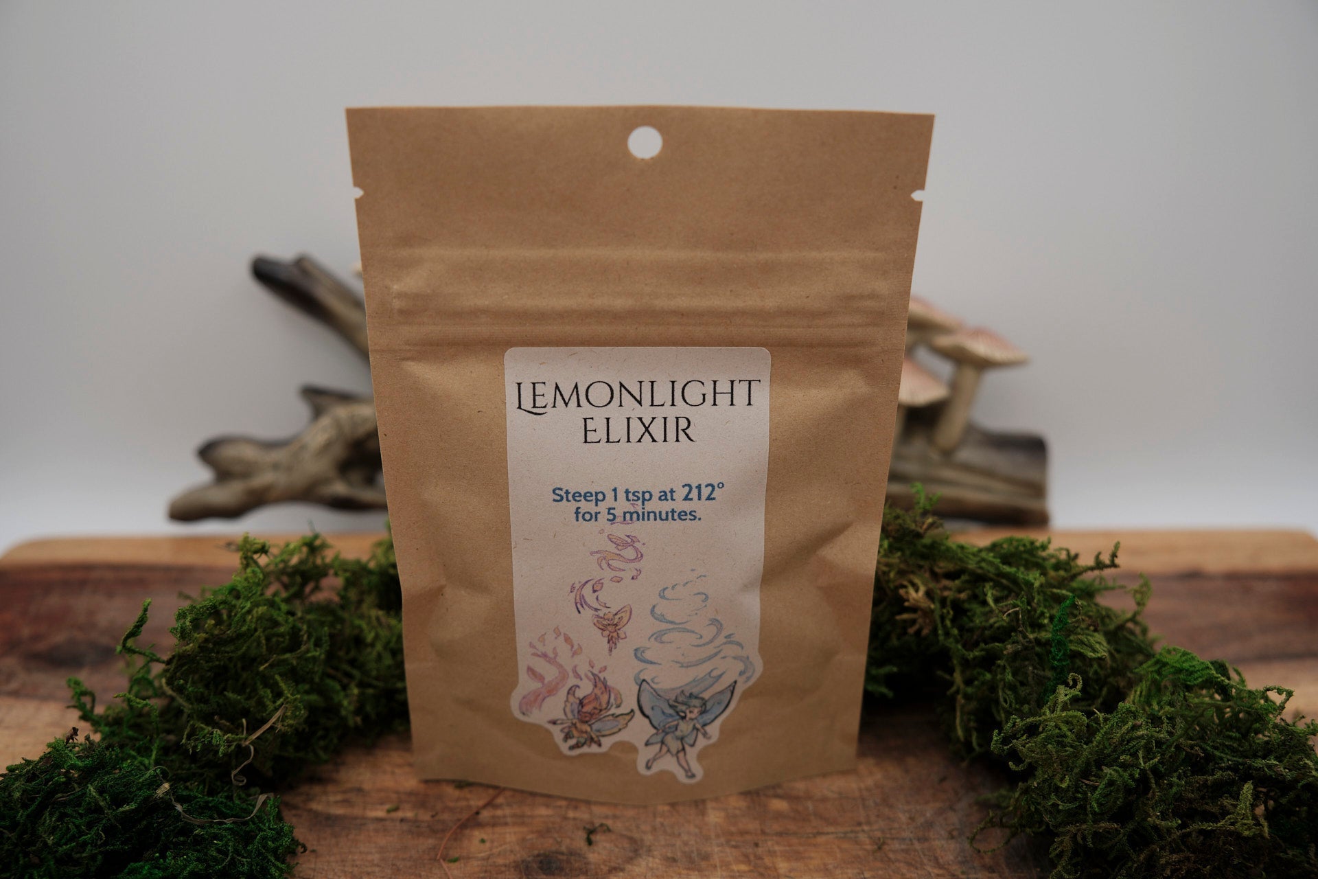 Morelitea Lemonlight Elixir Fairy Loose Leaf Tea in a clear container with dried lemon and herbs