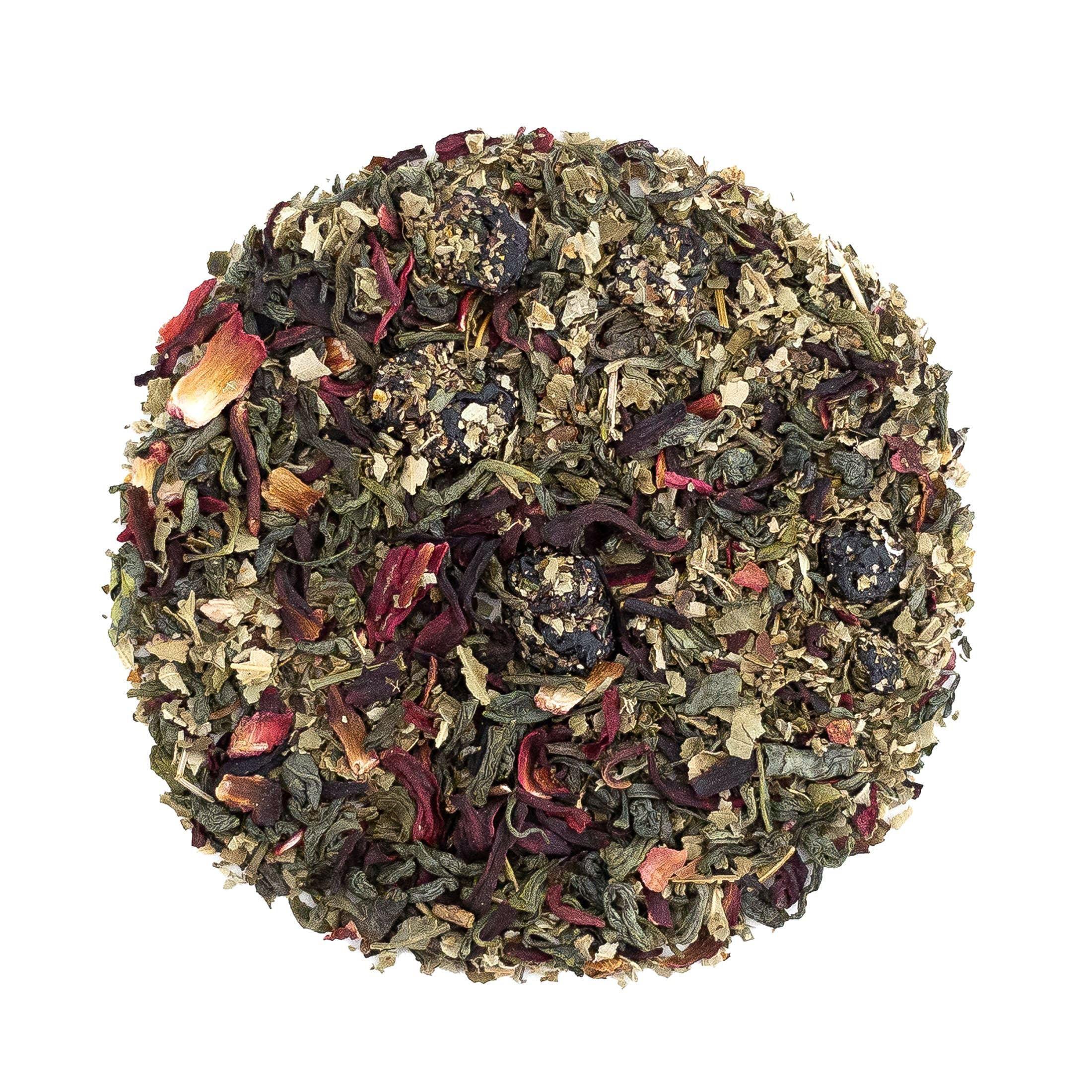 Loose leaf Blueberry Beach Breeze tea by Beach House, featuring dried blueberries and hibiscus in a natural setting.