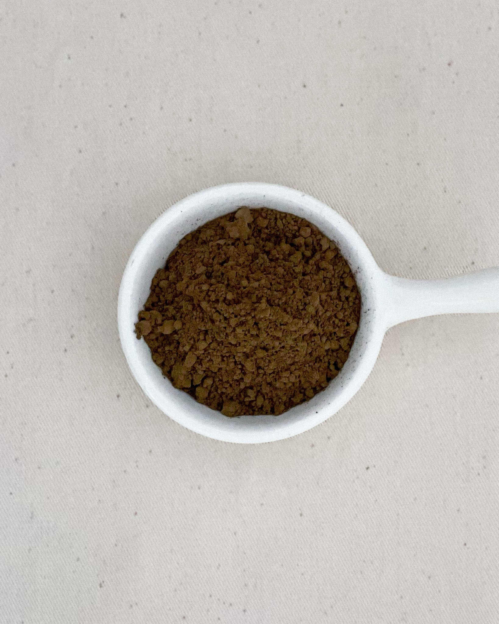 Teappo Organic Hojicha Powder in a package, showcasing its earthy brown color and fine texture
