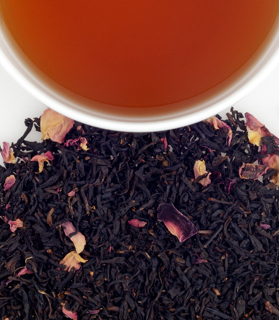 Harney & Sons Rose Scented tea displayed in a cup, featuring rosebuds and petals in the blend for visual appeal.