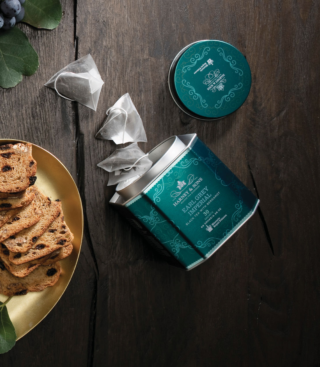 Harney & Sons Earl Grey Imperial, HRP Tin of 30 Sachets, shown in a mood setting with a focus on the tin packaging.