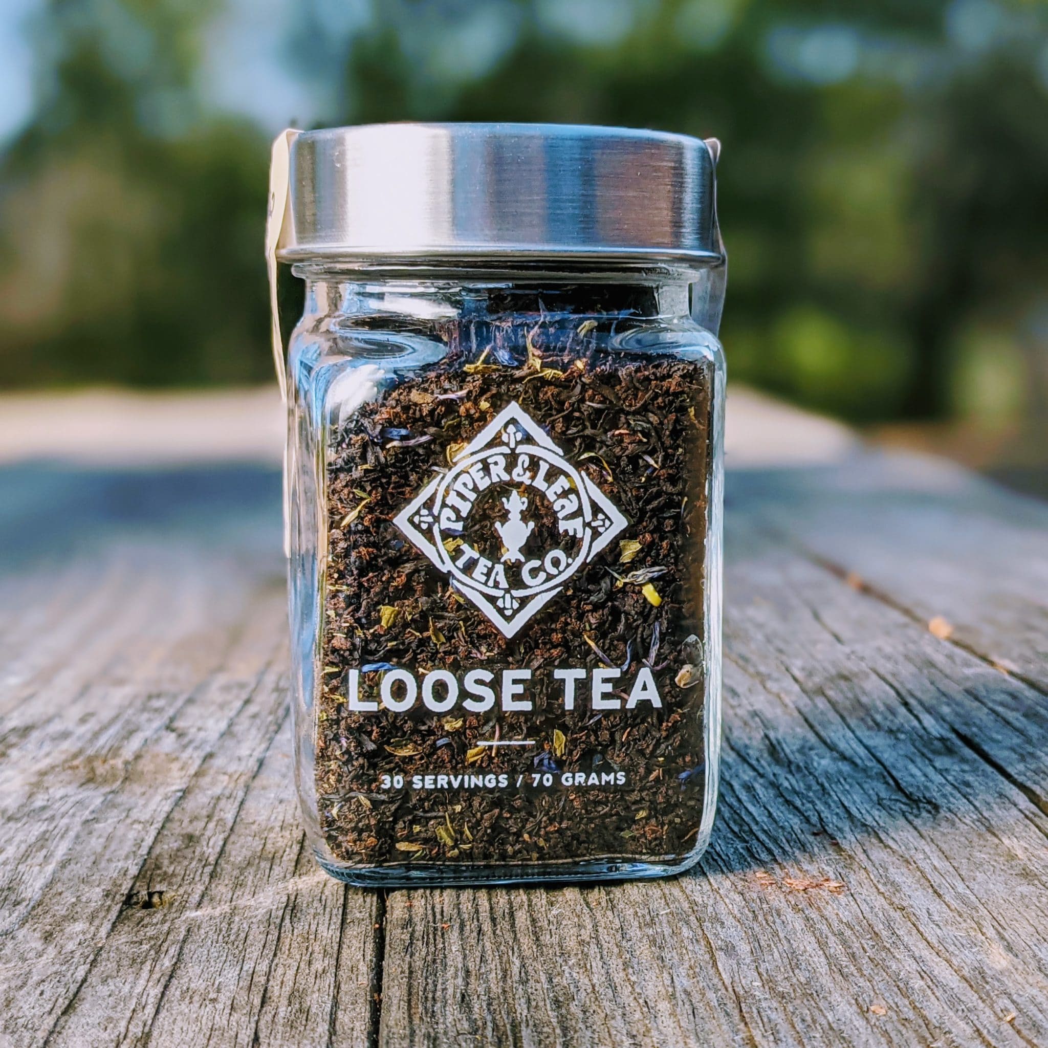Piper and Leaf Front Porch Special Glass Jar of Loose Leaf Tea - 30 Servings, showcasing a glass jar filled with loose leaf tea.