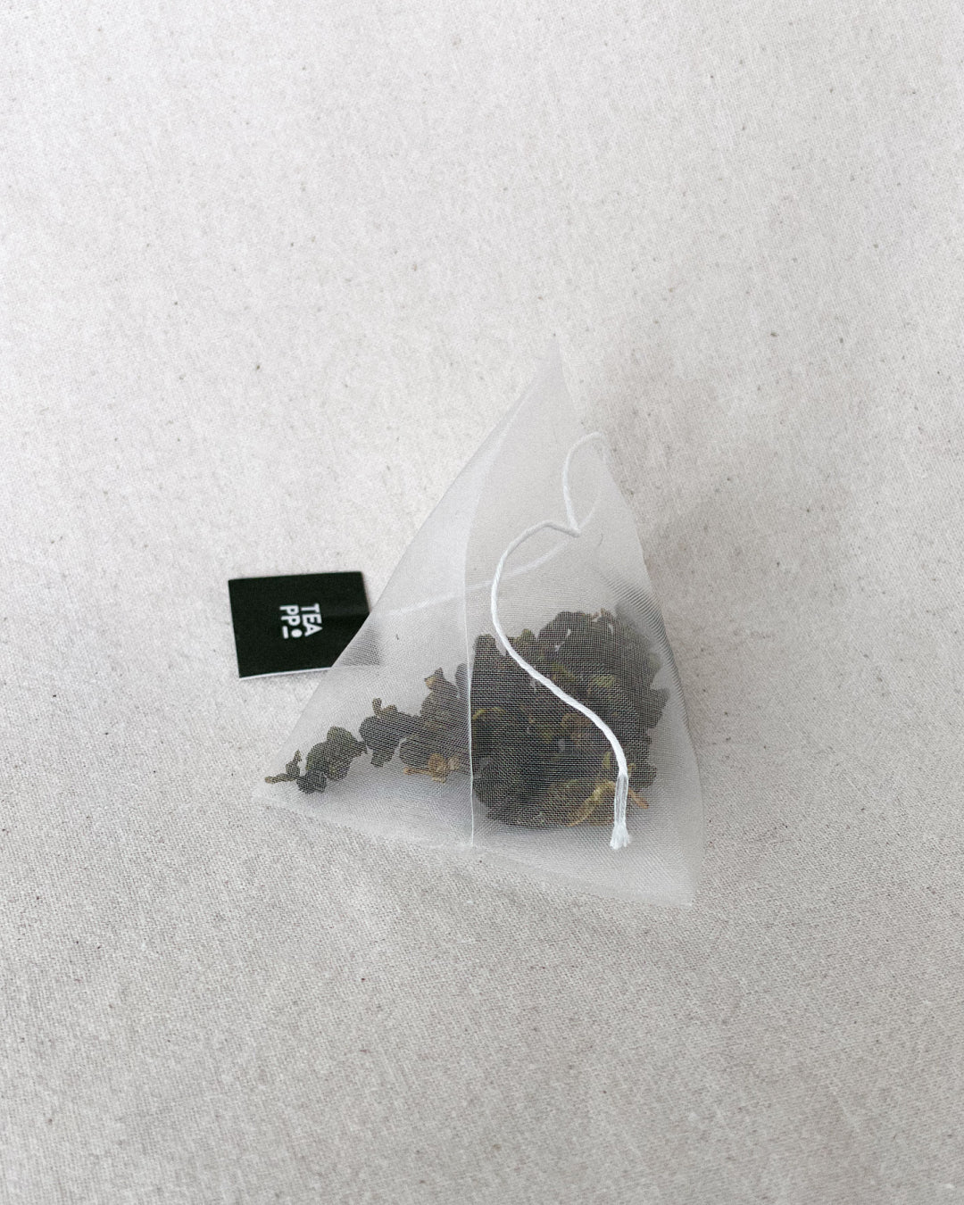 Teappo Four Springs tea product displayed in a clear packaging with a vibrant design, by vendor Teappo.