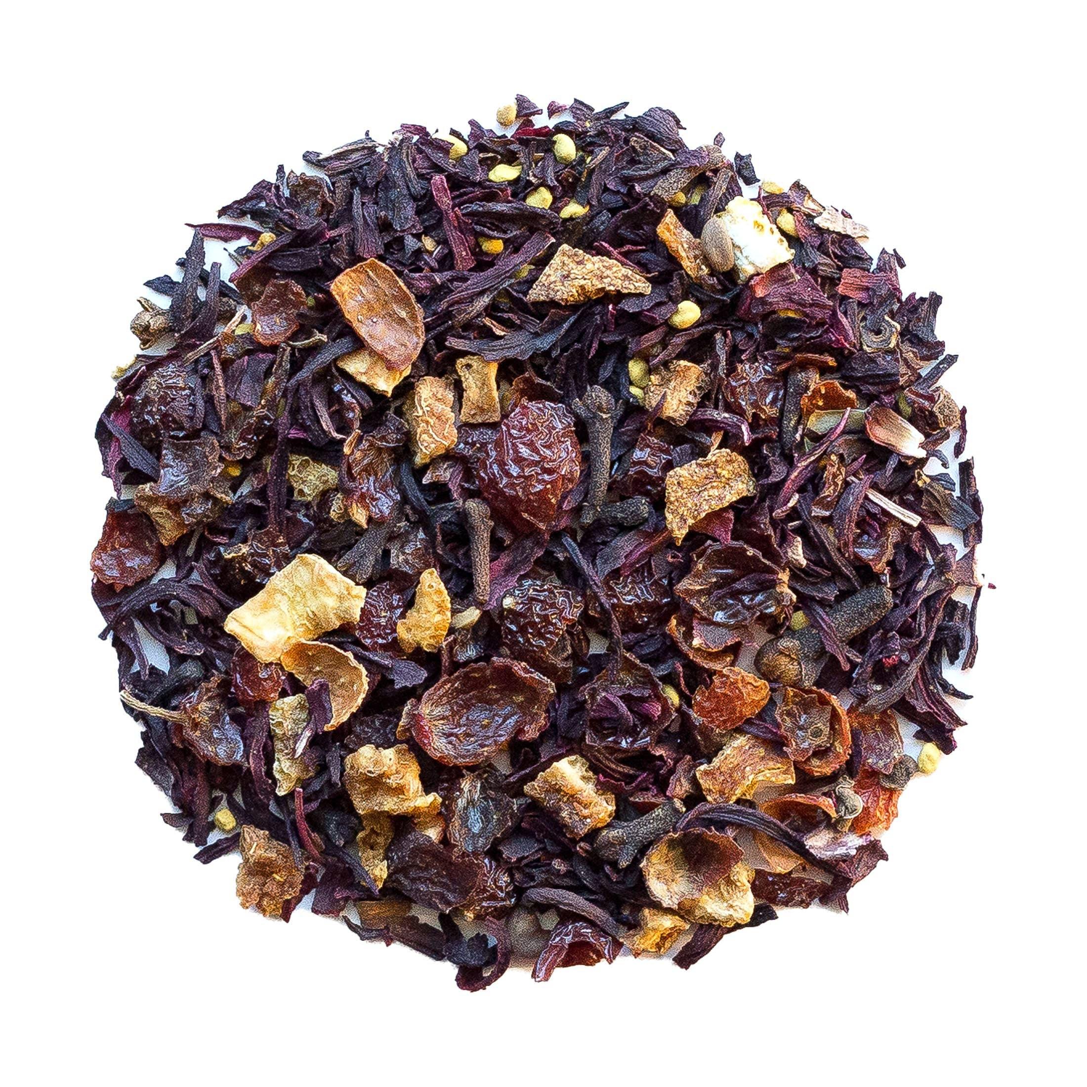 Beach House Warm Springs Frost tea leaves in an infuser, showcasing organic hibiscus, rose hips, cloves, orange peel, and bee pollen.