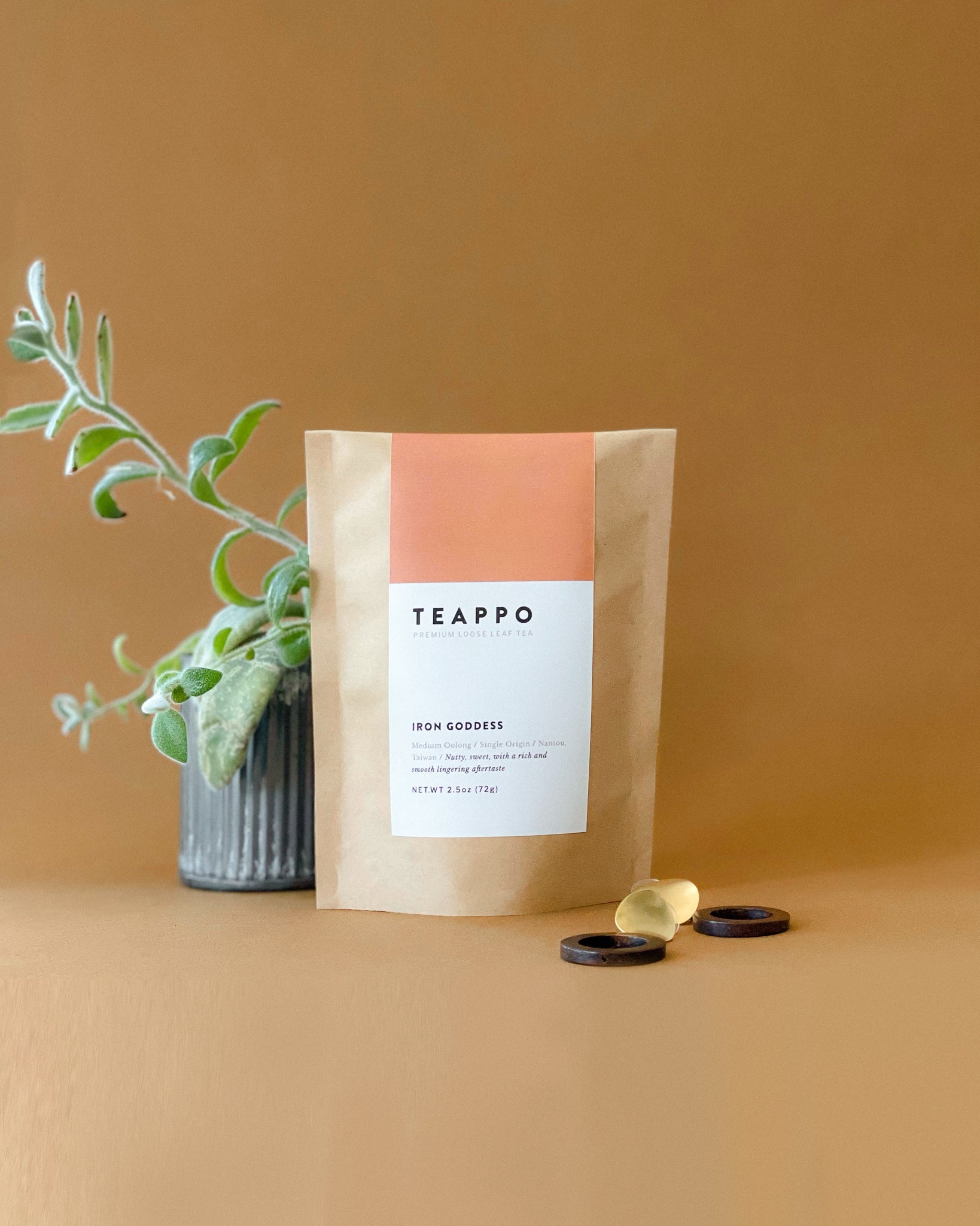 Teappo Iron Goddess oolong tea in a package, showcasing the leaves' rich, crimson-tinged edges, 2.5 oz. size.