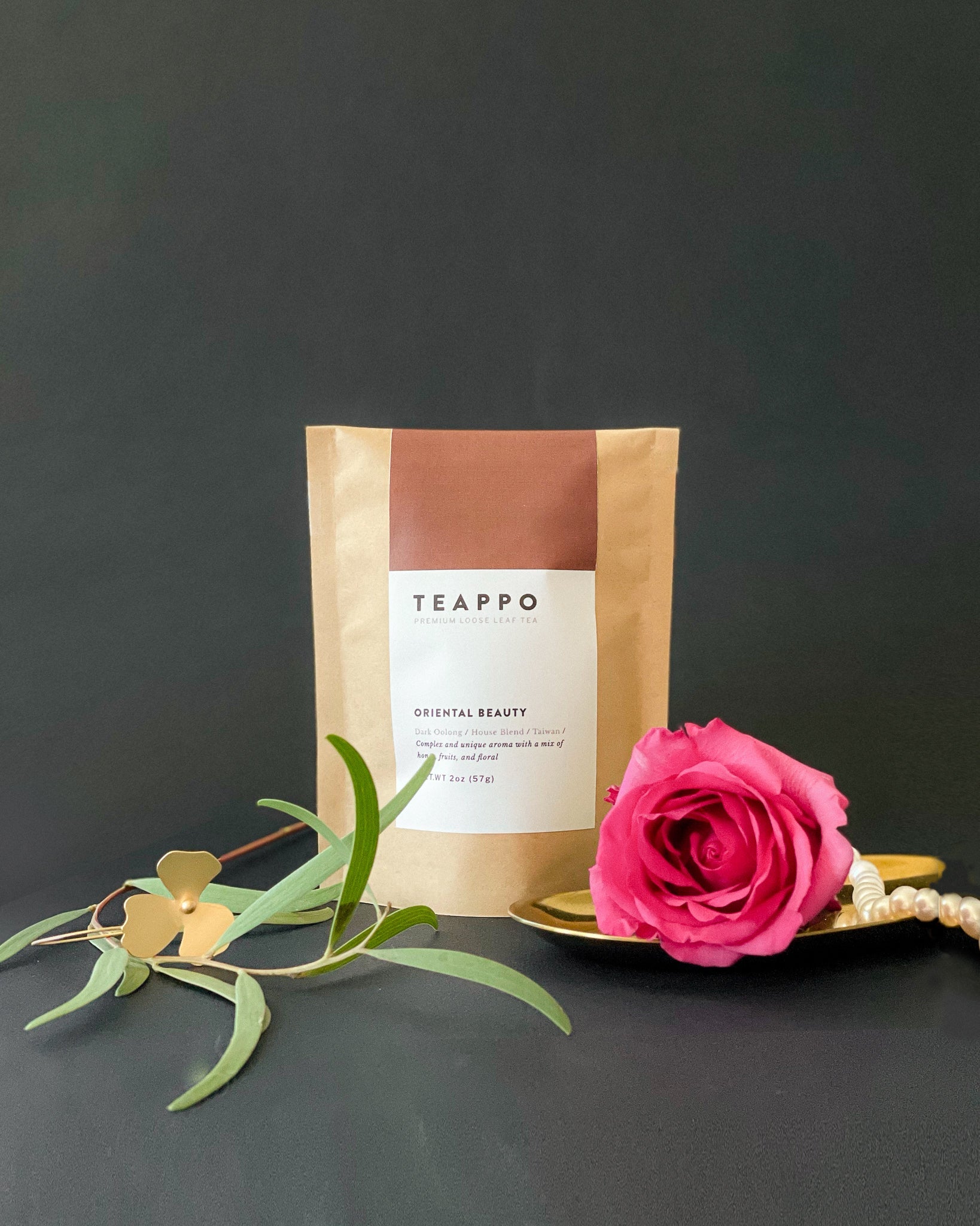Teappo Oriental Beauty tea leaves, showcasing a complex aroma of honey, fruits, and flowers, from Taiwan, 2 oz. package.
