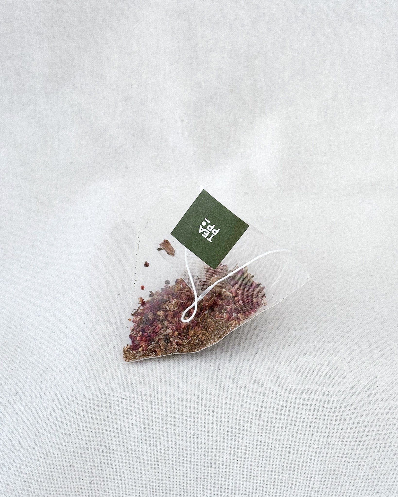 Teappo Sweet Moment - a close-up image of a packaged tea product with vibrant colors and branding from Teappo.