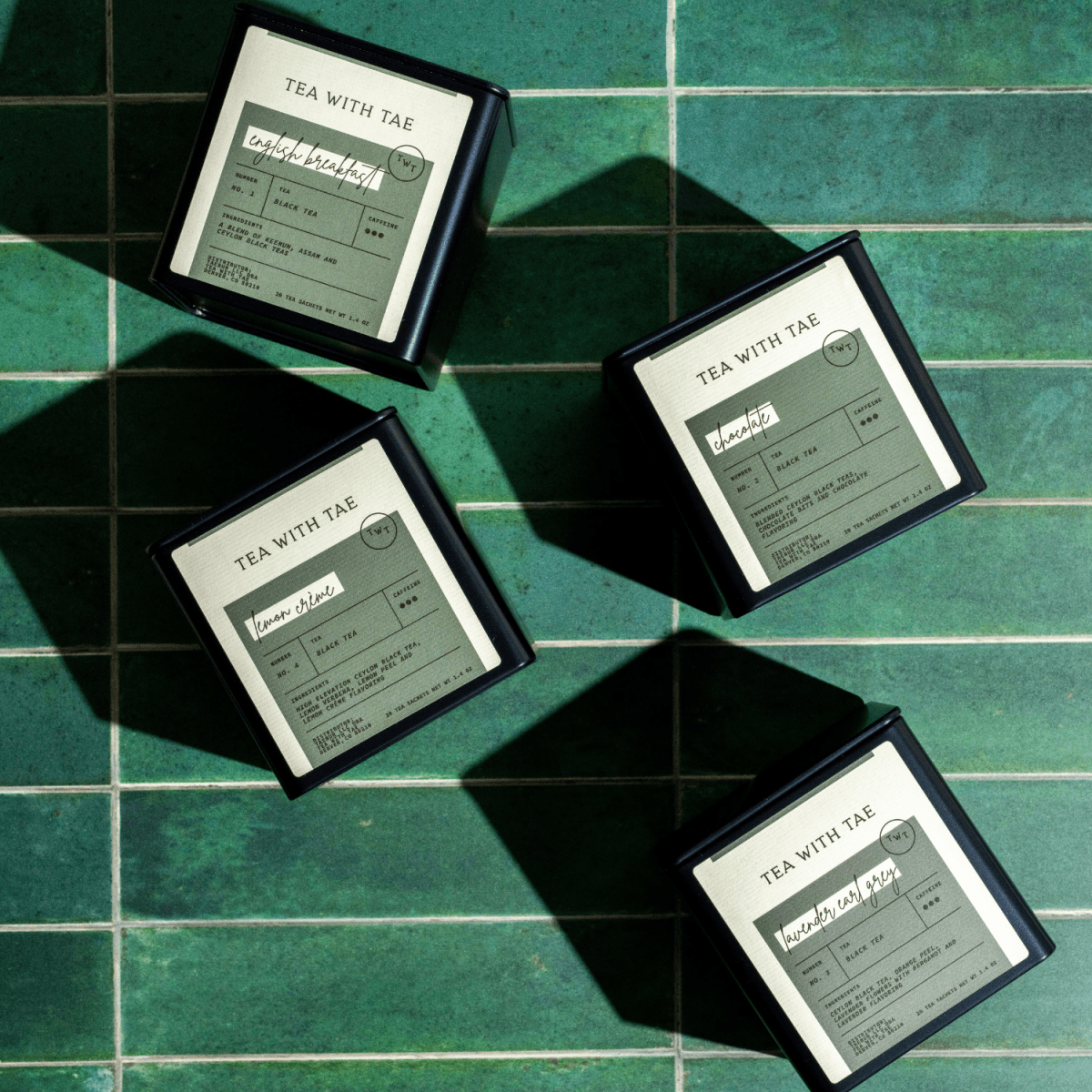 Tea with Tae Chocolate Black Tea Tin Gift (20 tea sachets) in a decorative tin package, featuring the brand's logo.