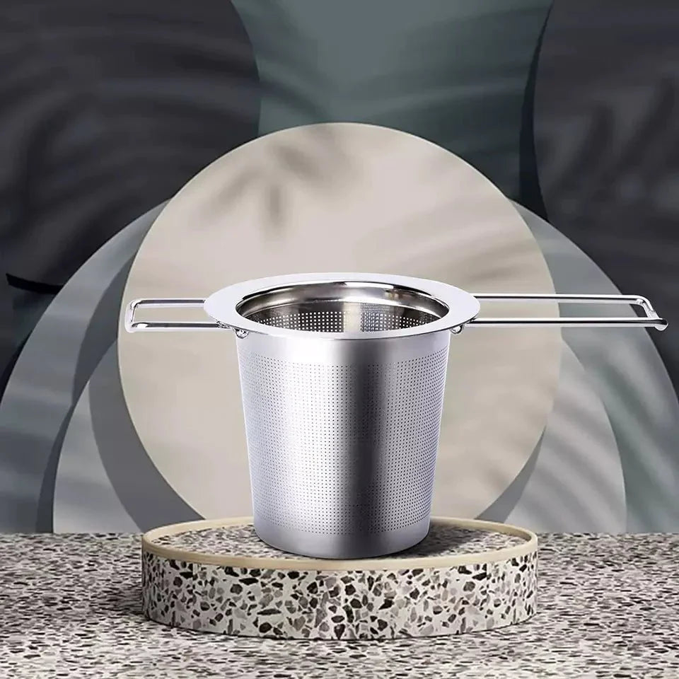 Foldable strainer by Nepal Tea, shown in the image, features a foldable handle and food-grade stainless steel design.