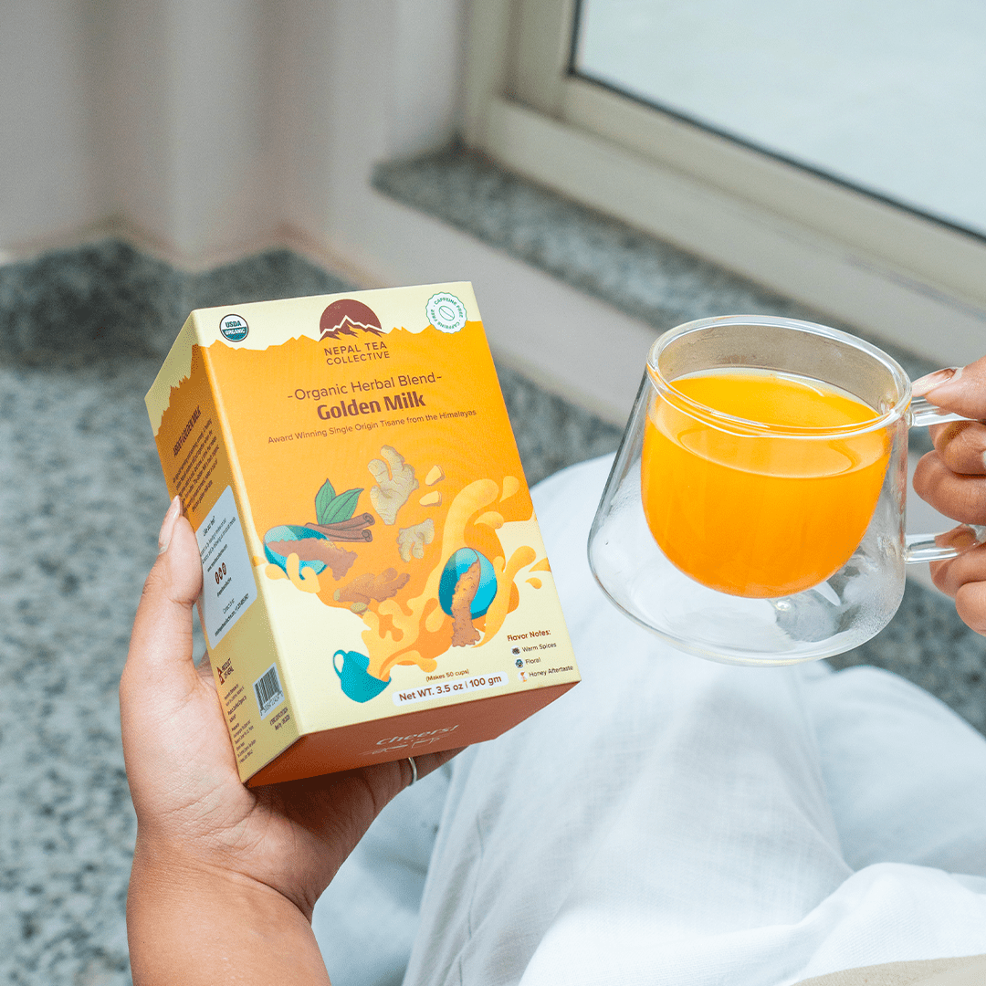 Organic Golden Milk by Nepal Tea in a bowl with a whisk, showcasing the golden color and texture of the beverage.