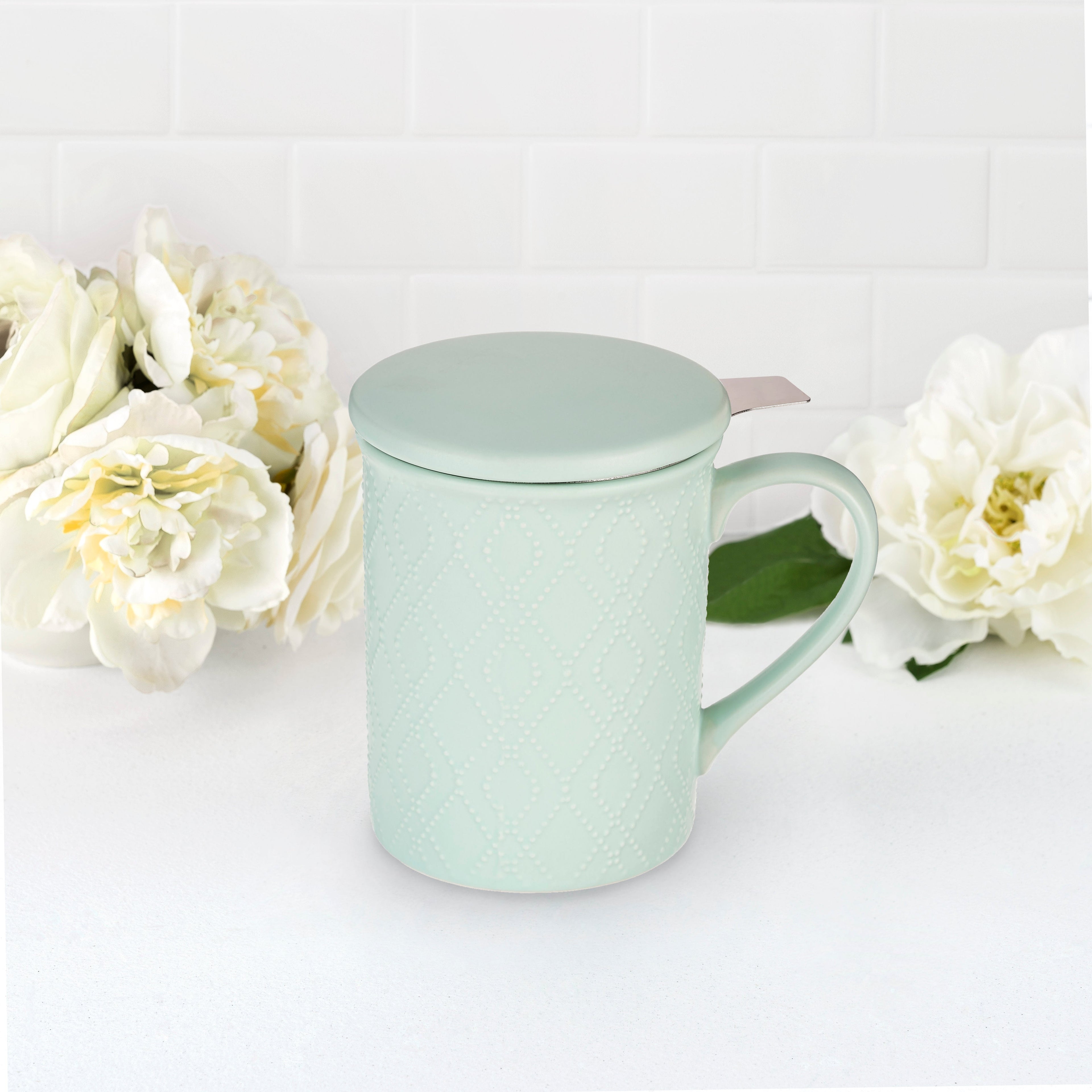 Pinky Up Annette: Souk Mint Ceramic Tea Mug & Infuser featuring a mint-colored ceramic mug with an infuser.