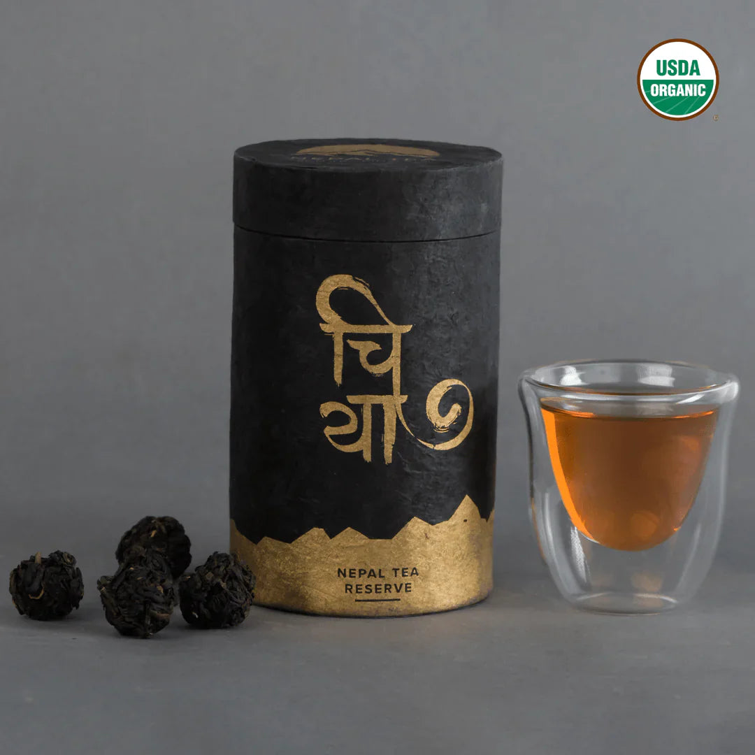 KTE Summer Bloom (Matyangra) tea leaves by Nepal Tea in a detailed display, showcasing their vibrant color and texture.