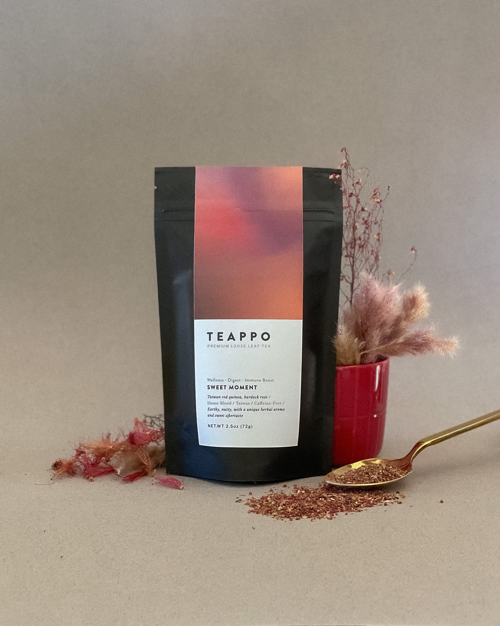 Teappo Sweet Moment herbal blend in a 2.5 oz package, featuring Taiwan red quinoa and burdock root, caffeine-free.
