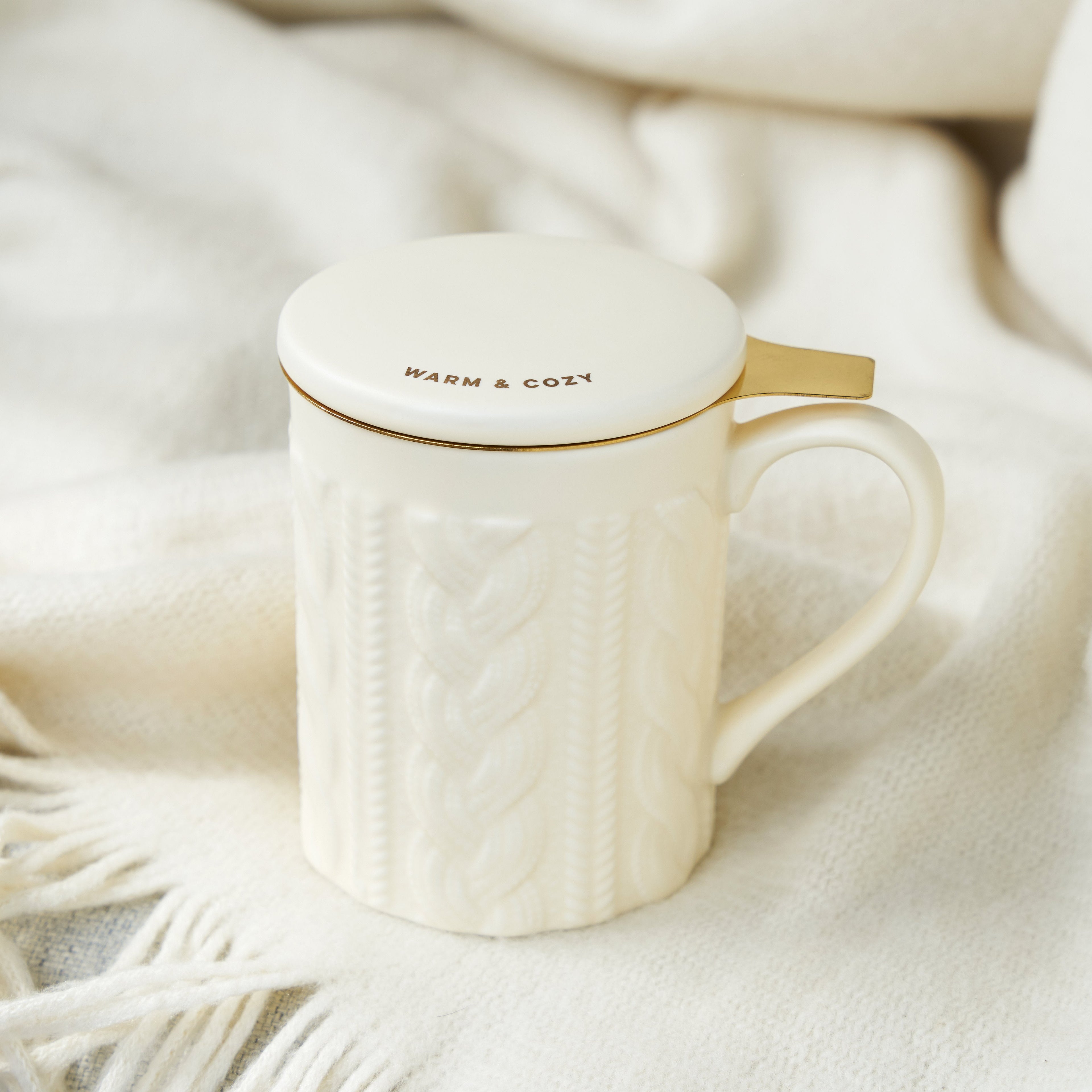 Pinky Up Annette Knit Ceramic Tea Mug & Infuser with a textured knit design in pink color on a white background.