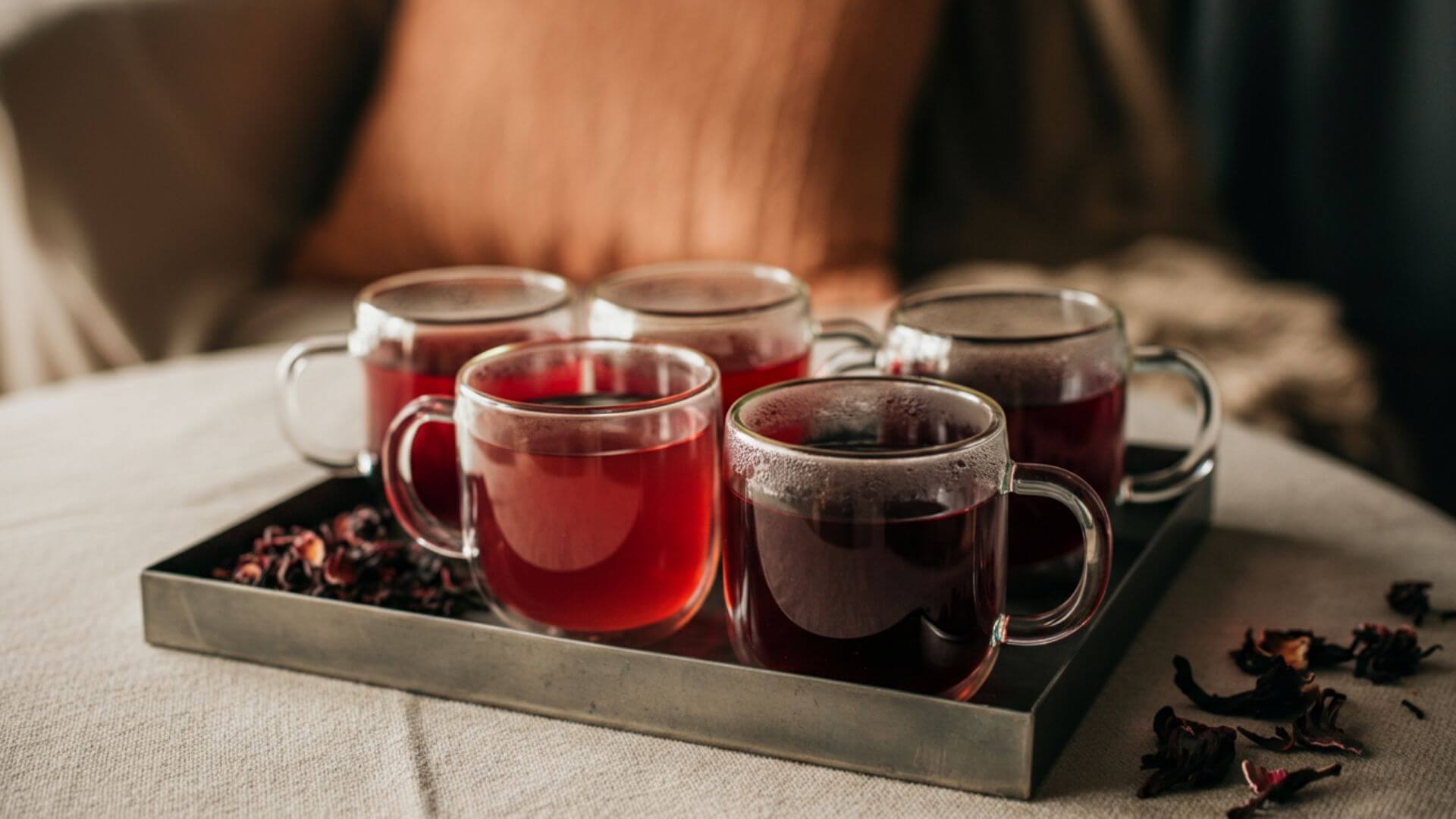 5 glass of hibiscus teas in a silver tray