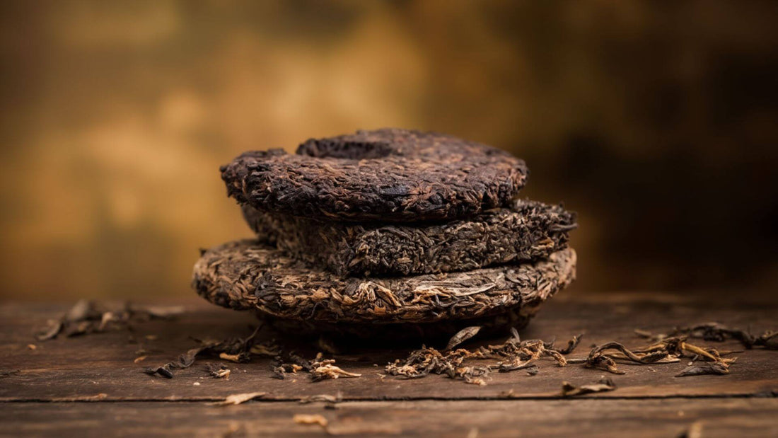 3 pieces of Pu erh tea cakes on top of each other