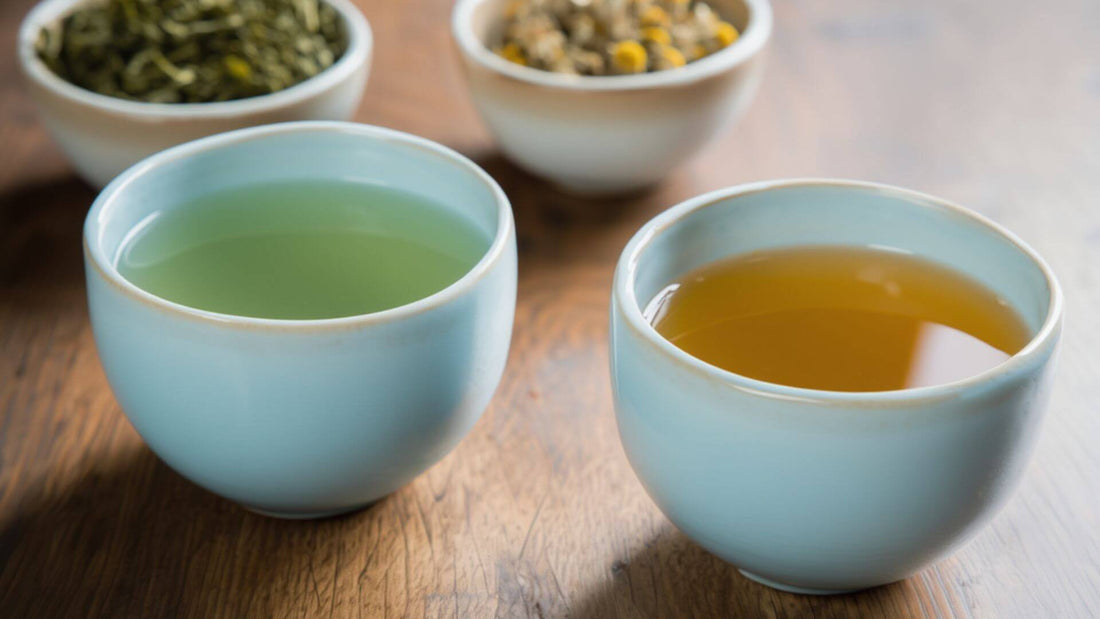 Green tea and chamomile tea in a teacup