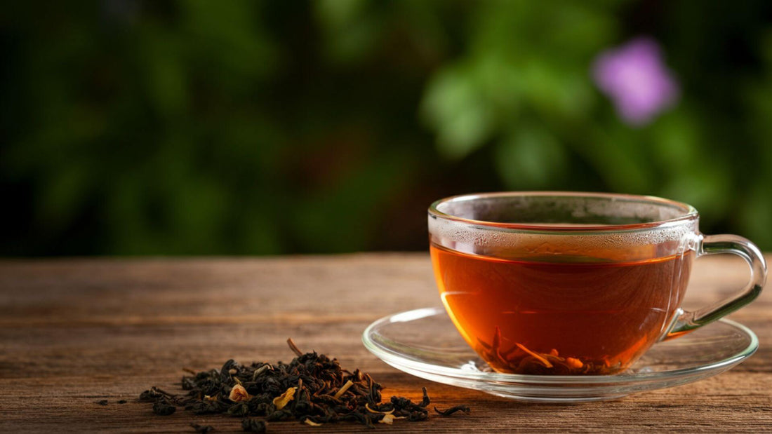 Earl grey tea in a teacup with bergamot fruit on the side