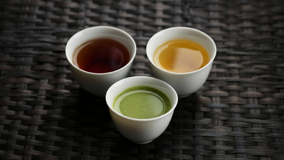 Three white tea cups of tea are organized properly in a triangular formation