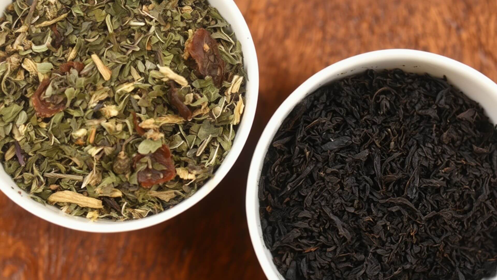 A bowl on the left containing herbal leaves and a right bowl containing loose leaf black tea