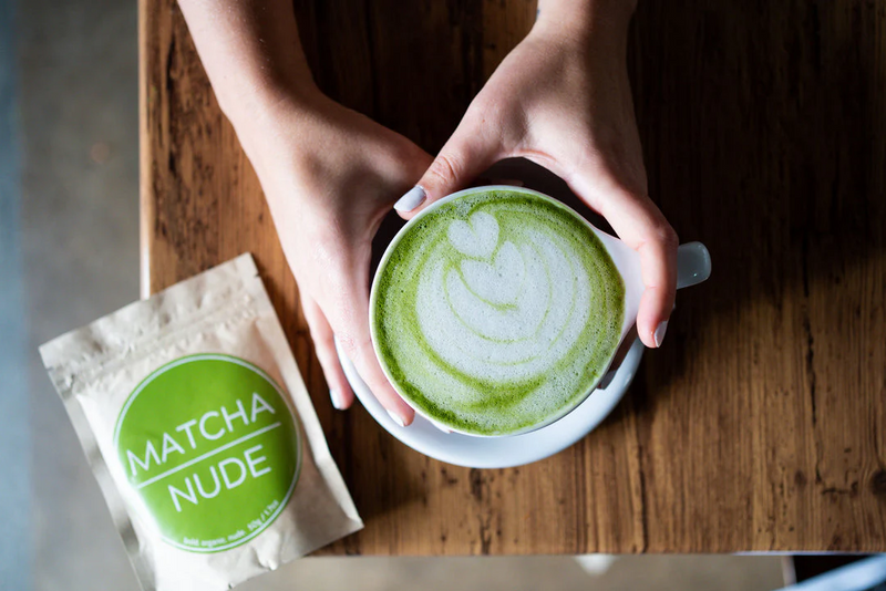 Matcha Nude tea with a cup of Matcha with a heart shaped design