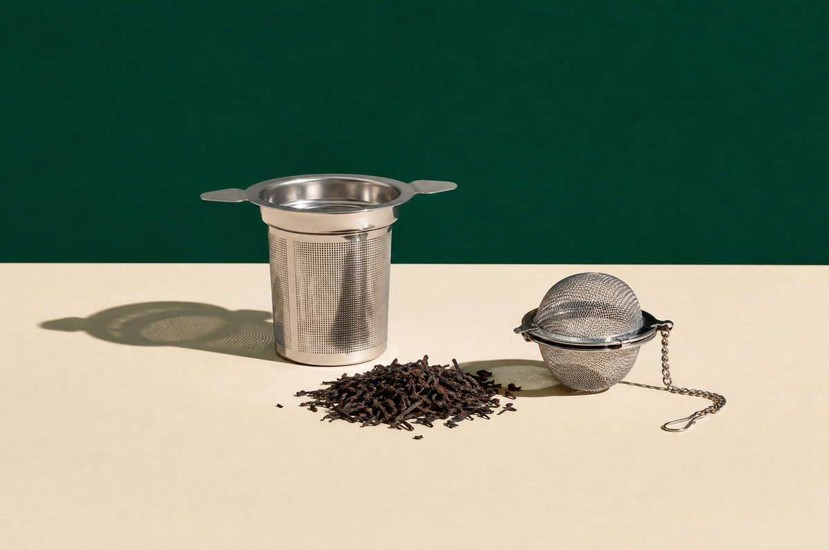 A stainless steel fine-mesh basket tea infuser with two small side handles