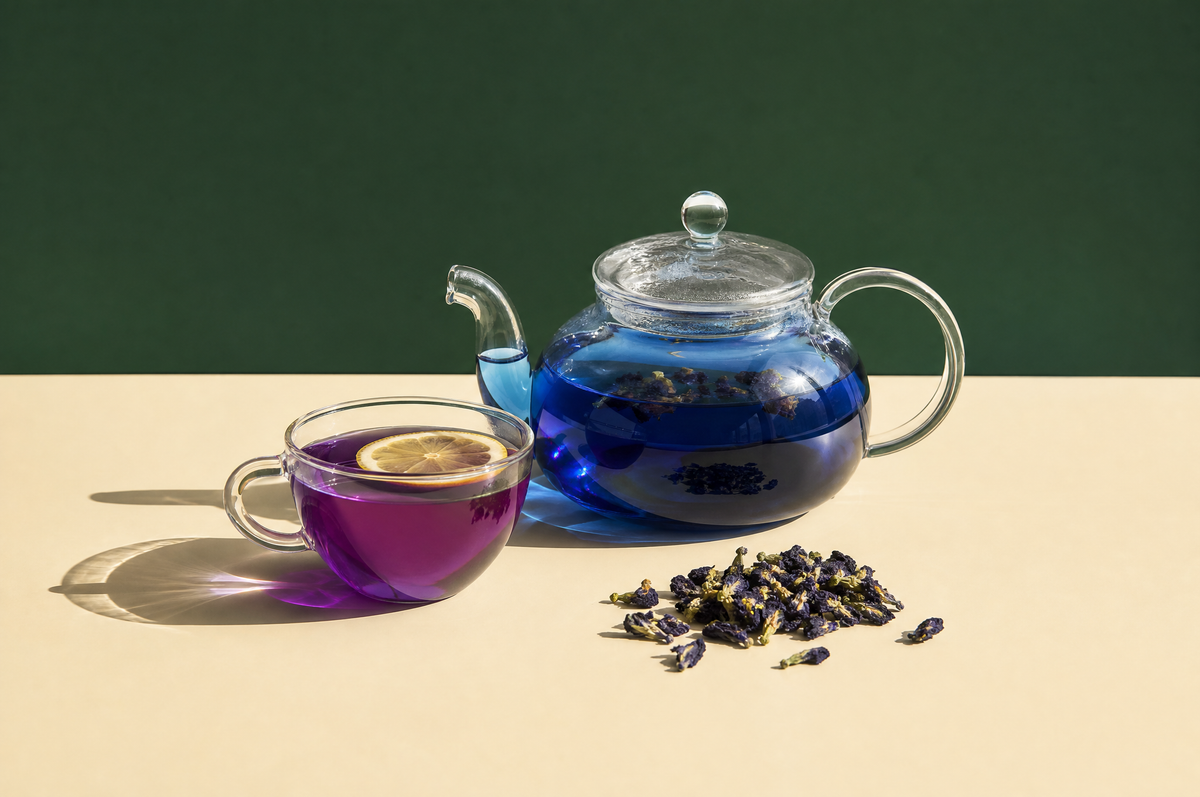 A clear glass teapot of vivid cobalt-blue butterfly pea flower tea