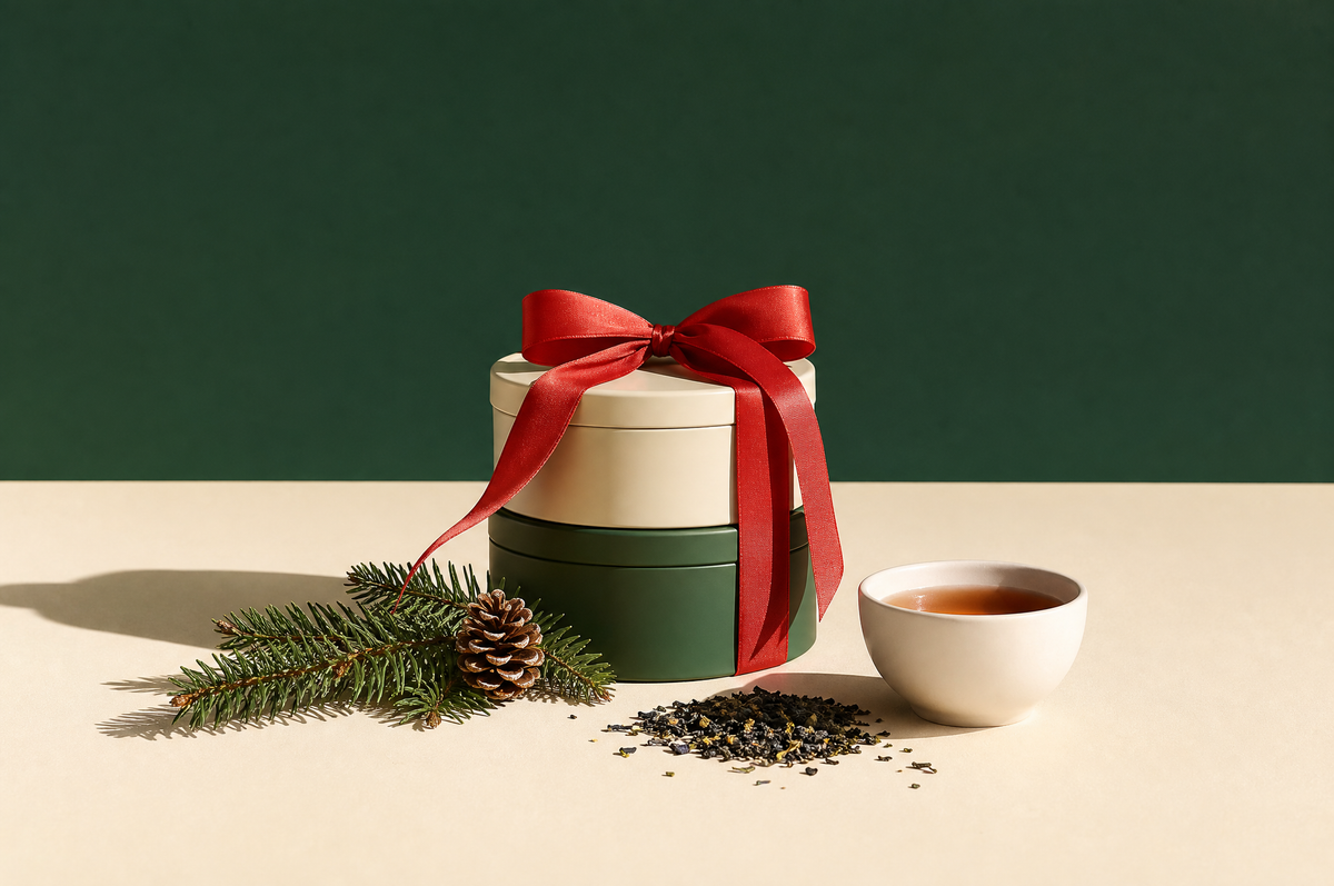 Christmas tea gift tins tied with a red ribbon