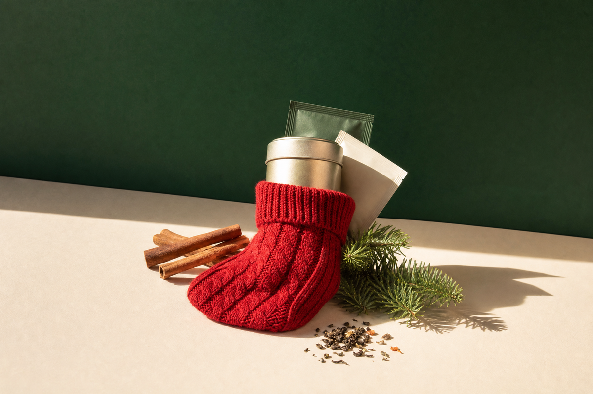Tea stocking stuffers: a mini tea tin and sachets in a red stocking
