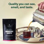 August Low Country - Bourbon Sugar Black Tea in a glass jar, showcasing loose leaf tea with bourbon sugar notes.