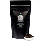 August Passage - Hazelnut Chocolate Black Tea in a tea bag with packaging, displayed against a neutral background.