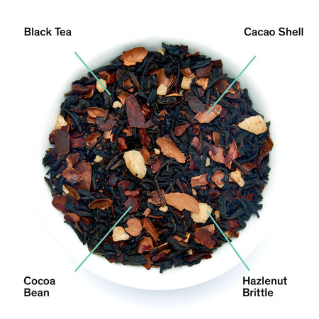 August Passage - Hazelnut Chocolate Black Tea by August, featuring loose black tea leaves with cocoa and hazelnut pieces.