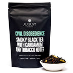 August Civil Disobedience - Smoky Cardamom Black Tea in a 15-cup bag, displayed for product presentation.