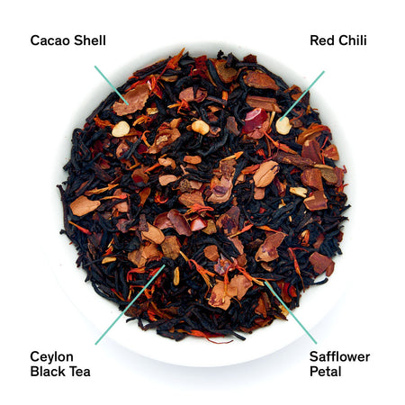 August Painted Desert - Chocolate Chili Black Tea by August, showing tea leaves and ingredients like cacao and cinnamon.