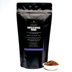 August Silent Night - Chocolate Nutmeg Rooibos (Caffeine Free) packaged in a tea bag, featuring a clear view of the product.