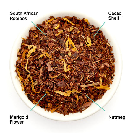 August Silent Night - Chocolate Nutmeg Rooibos (Caffeine Free) loose leaf tea, showing dried ingredients and herbs in a bowl.