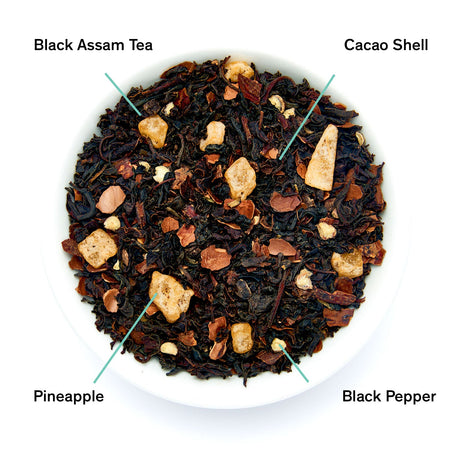 August Silencio - Spicy Pineapple Black Tea from August, showing dried tea leaves with hints of pineapple and cocoa.