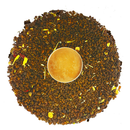 Danfe Vanilla Chai loose leaf tea leaves with brewed chai liquor in a cup, showcasing the creamy blend of black tea, cardamom, and vanilla.