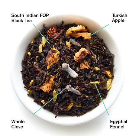 August Mackintosh - Crisp Apple Black Tea, by August, shows loose black tea leaves with apple and spices in a clear container.