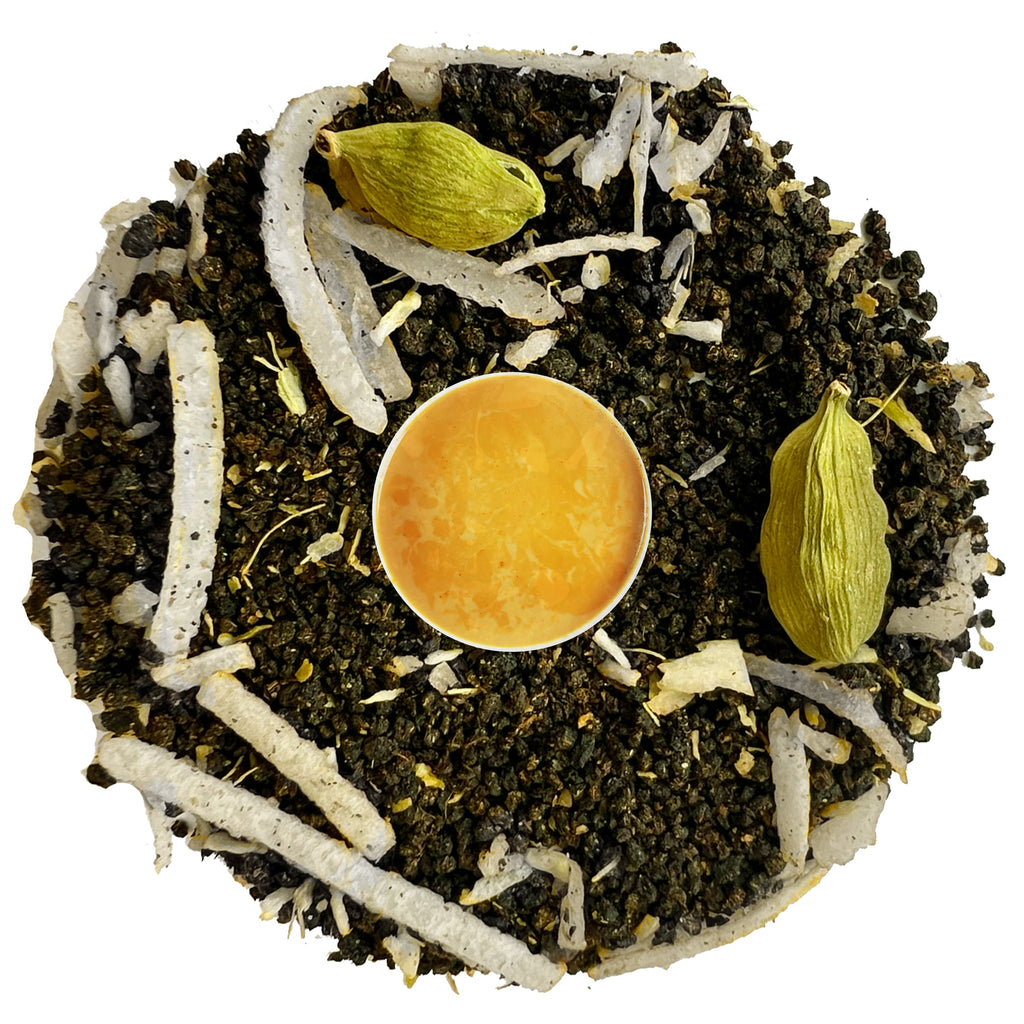Tea blend with green cardamom pods, white strands, and a yellow tea ball on a white background