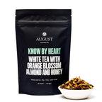 August Know by Heart - Orange Blossom Almond White Tea in a 15-cup bag, featuring a vibrant orange and white design.