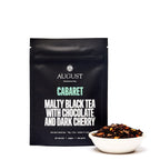 August Cabaret - Cherry Chocolate Black Tea in four cups, showcasing rich colors and textures of the tea blend.