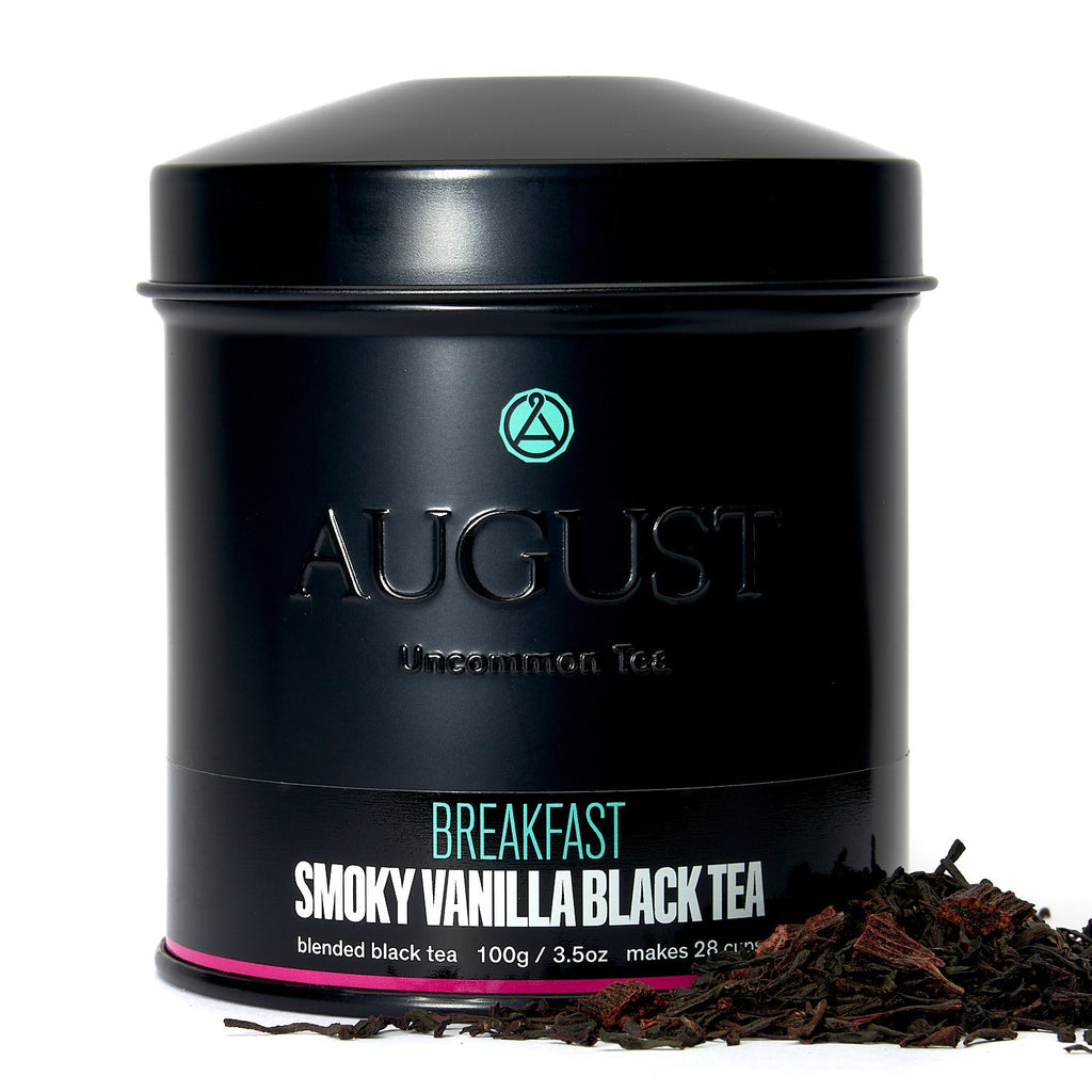 Smoky Vanilla Black Tea by August in a tin with loose tea leaves, featuring a modern design and earthy colors.